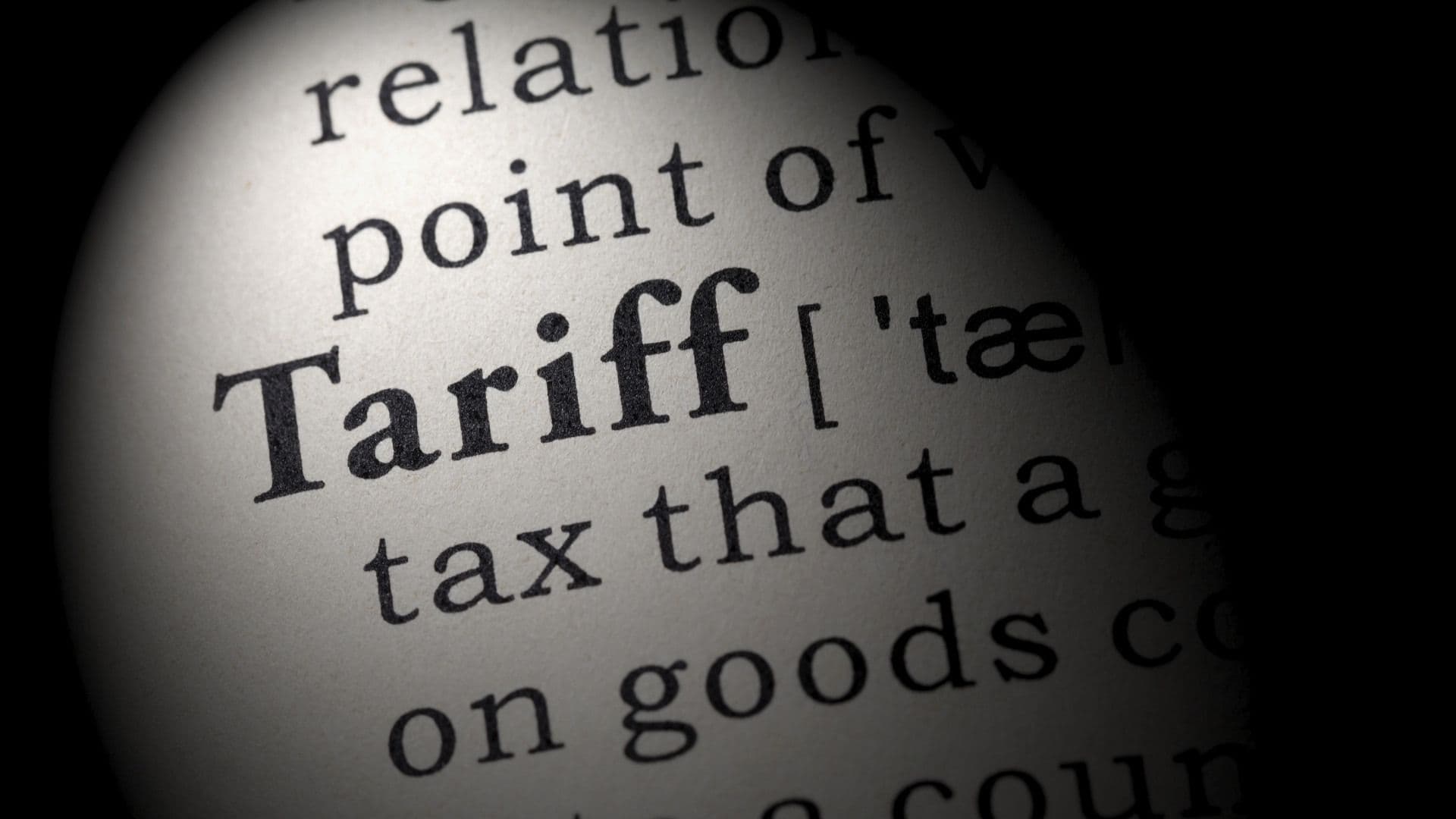 a definition of the word tariff written across the page